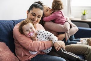 lgbt-mothers-at-home-on-the-sofa-with-children